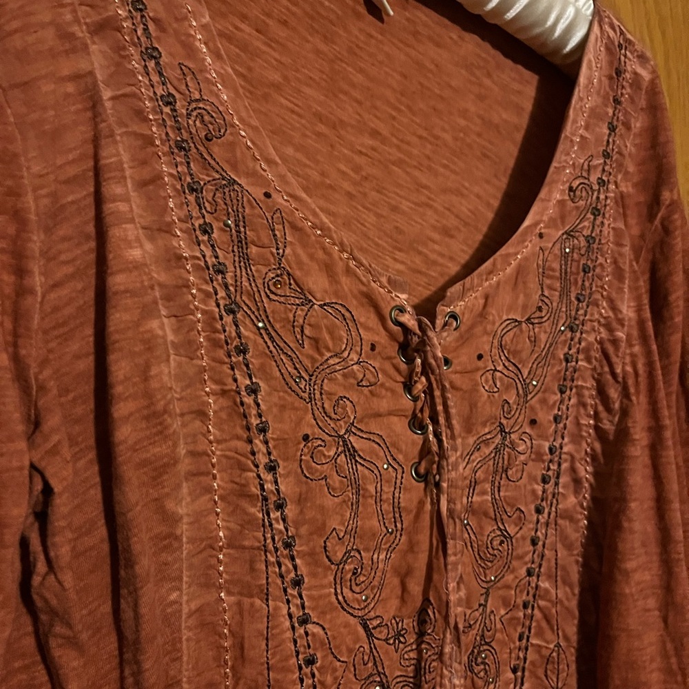 Reba brand blouse with embroidery detail.